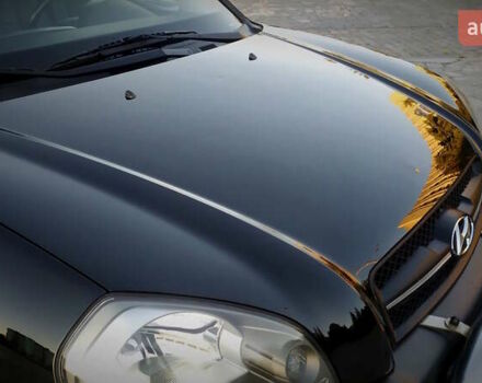 Черный Хендай Туксон, объемом двигателя 2 л и пробегом 230 тыс. км за 8600 $, фото 49 на Automoto.ua