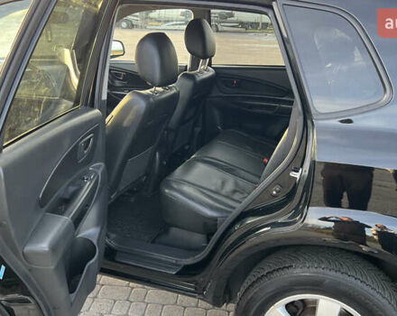 Черный Хендай Туксон, объемом двигателя 1.98 л и пробегом 243 тыс. км за 8500 $, фото 31 на Automoto.ua