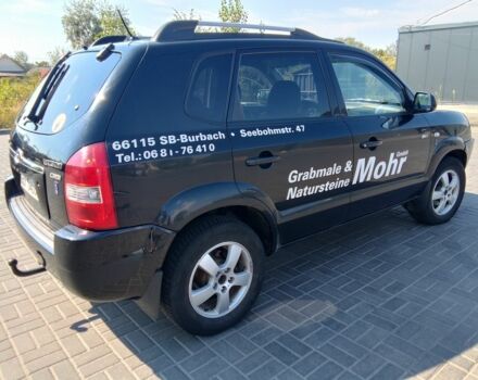Черный Хендай Туксон, объемом двигателя 2 л и пробегом 250 тыс. км за 3700 $, фото 3 на Automoto.ua
