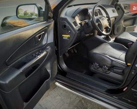 Черный Хендай Туксон, объемом двигателя 2 л и пробегом 230 тыс. км за 8600 $, фото 137 на Automoto.ua