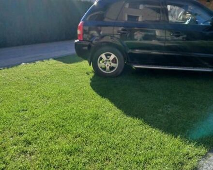 Черный Хендай Туксон, объемом двигателя 2 л и пробегом 15 тыс. км за 6200 $, фото 1 на Automoto.ua