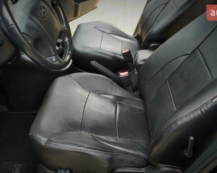Чорний Хендай Туксон, об'ємом двигуна 2 л та пробігом 229 тис. км за 8600 $, фото 106 на Automoto.ua