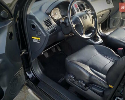 Черный Хендай Туксон, объемом двигателя 2 л и пробегом 230 тыс. км за 8600 $, фото 146 на Automoto.ua