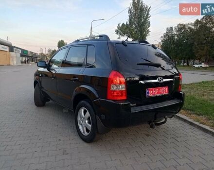 Чорний Хендай Туксон, об'ємом двигуна 1.98 л та пробігом 192 тис. км за 7950 $, фото 4 на Automoto.ua
