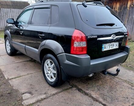 Черный Хендай Туксон, объемом двигателя 2 л и пробегом 272 тыс. км за 7500 $, фото 4 на Automoto.ua