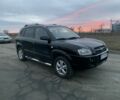 Черный Хендай Туксон, объемом двигателя 2 л и пробегом 170 тыс. км за 8800 $, фото 1 на Automoto.ua