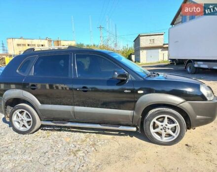 Черный Хендай Туксон, объемом двигателя 2 л и пробегом 219 тыс. км за 8500 $, фото 1 на Automoto.ua