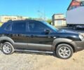 Черный Хендай Туксон, объемом двигателя 2 л и пробегом 219 тыс. км за 8500 $, фото 1 на Automoto.ua