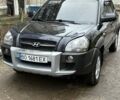 Черный Хендай Туксон, объемом двигателя 1.98 л и пробегом 273 тыс. км за 7400 $, фото 1 на Automoto.ua