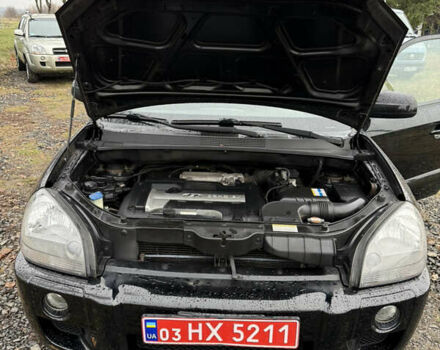 Чорний Хендай Туксон, об'ємом двигуна 2 л та пробігом 196 тис. км за 7250 $, фото 26 на Automoto.ua