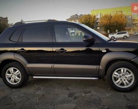 Черный Хендай Туксон, объемом двигателя 2 л и пробегом 230 тыс. км за 8600 $, фото 124 на Automoto.ua