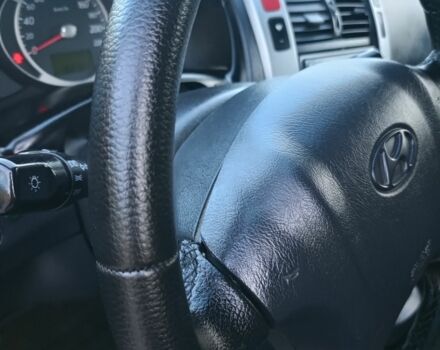 Черный Хендай Туксон, объемом двигателя 2 л и пробегом 192 тыс. км за 7950 $, фото 16 на Automoto.ua