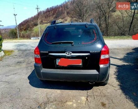 Черный Хендай Туксон, объемом двигателя 2 л и пробегом 218 тыс. км за 7700 $, фото 2 на Automoto.ua