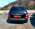 Черный Хендай Туксон, объемом двигателя 2 л и пробегом 218 тыс. км за 7700 $, фото 2 на Automoto.ua