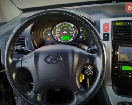 Черный Хендай Туксон, объемом двигателя 2 л и пробегом 230 тыс. км за 8600 $, фото 158 на Automoto.ua