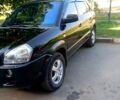 Чорний Хендай Туксон, об'ємом двигуна 2 л та пробігом 230 тис. км за 6900 $, фото 1 на Automoto.ua