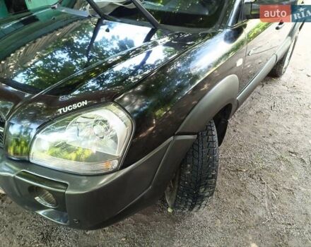 Черный Хендай Туксон, объемом двигателя 2 л и пробегом 170 тыс. км за 8500 $, фото 32 на Automoto.ua