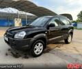 Черный Хендай Туксон, объемом двигателя 2 л и пробегом 200 тыс. км за 7400 $, фото 1 на Automoto.ua
