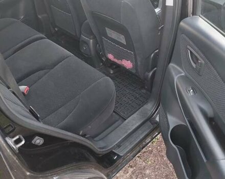 Черный Хендай Туксон, объемом двигателя 1.98 л и пробегом 200 тыс. км за 7100 $, фото 4 на Automoto.ua