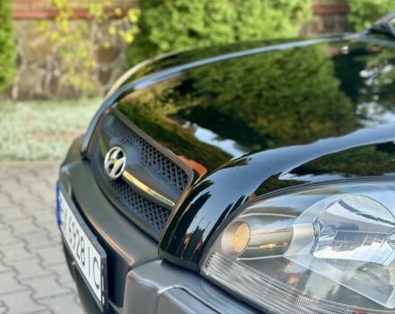 Черный Хендай Туксон, объемом двигателя 2 л и пробегом 199 тыс. км за 7777 $, фото 3 на Automoto.ua