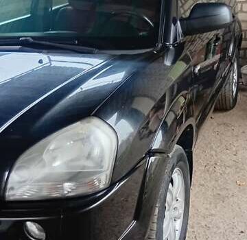 Черный Хендай Туксон, объемом двигателя 1.98 л и пробегом 218 тыс. км за 7800 $, фото 1 на Automoto.ua