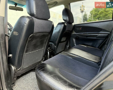 Черный Хендай Туксон, объемом двигателя 2 л и пробегом 300 тыс. км за 7350 $, фото 61 на Automoto.ua