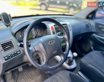 Черный Хендай Туксон, объемом двигателя 2 л и пробегом 227 тыс. км за 8200 $, фото 24 на Automoto.ua