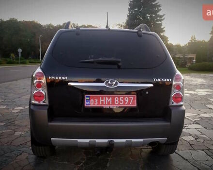 Черный Хендай Туксон, объемом двигателя 2 л и пробегом 230 тыс. км за 8600 $, фото 106 на Automoto.ua