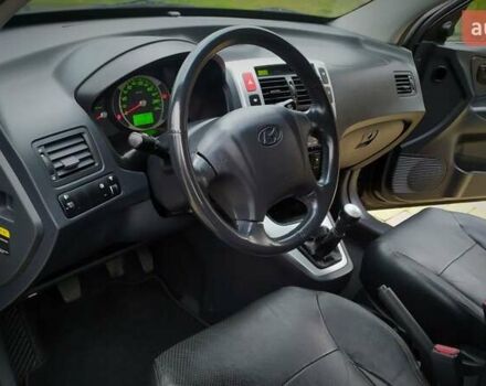 Чорний Хендай Туксон, об'ємом двигуна 2 л та пробігом 229 тис. км за 8600 $, фото 107 на Automoto.ua