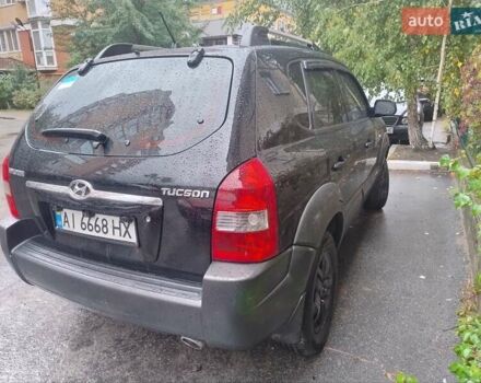 Чорний Хендай Туксон, об'ємом двигуна 1.98 л та пробігом 234 тис. км за 8000 $, фото 6 на Automoto.ua