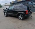 Черный Хендай Туксон, объемом двигателя 2 л и пробегом 255 тыс. км за 8400 $, фото 6 на Automoto.ua