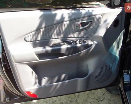 Черный Хендай Туксон, объемом двигателя 1.98 л и пробегом 234 тыс. км за 7800 $, фото 5 на Automoto.ua