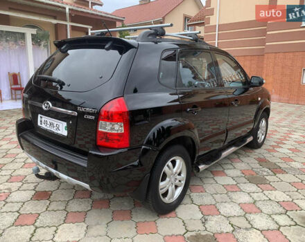 Черный Хендай Туксон, объемом двигателя 2 л и пробегом 219 тыс. км за 8600 $, фото 5 на Automoto.ua