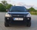 Черный Хендай Туксон, объемом двигателя 2 л и пробегом 232 тыс. км за 1700 $, фото 1 на Automoto.ua
