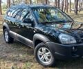 Черный Хендай Туксон, объемом двигателя 1.98 л и пробегом 235 тыс. км за 7700 $, фото 1 на Automoto.ua