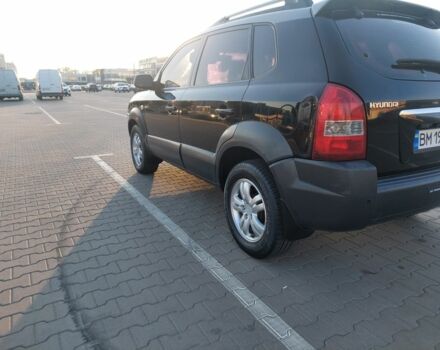 Черный Хендай Туксон, объемом двигателя 2 л и пробегом 289 тыс. км за 6600 $, фото 3 на Automoto.ua