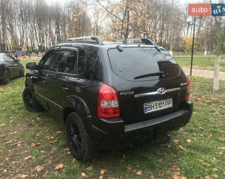 Черный Хендай Туксон, объемом двигателя 2 л и пробегом 210 тыс. км за 8999 $, фото 28 на Automoto.ua