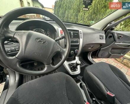 Черный Хендай Туксон, объемом двигателя 2 л и пробегом 218 тыс. км за 7600 $, фото 30 на Automoto.ua