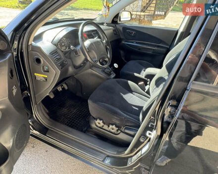 Черный Хендай Туксон, объемом двигателя 2 л и пробегом 189 тыс. км за 8250 $, фото 29 на Automoto.ua