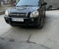 Черный Хендай Туксон, объемом двигателя 2 л и пробегом 240 тыс. км за 6200 $, фото 1 на Automoto.ua