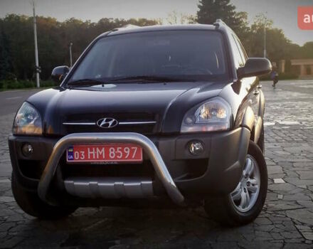 Черный Хендай Туксон, объемом двигателя 2 л и пробегом 230 тыс. км за 8600 $, фото 1 на Automoto.ua