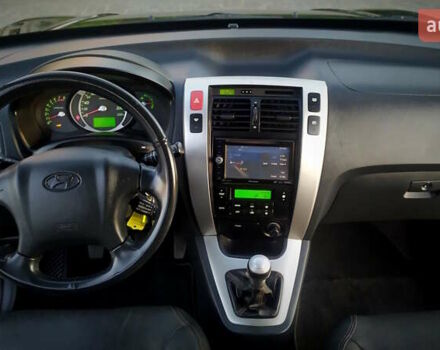 Черный Хендай Туксон, объемом двигателя 2 л и пробегом 230 тыс. км за 8600 $, фото 155 на Automoto.ua