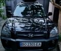 Черный Хендай Туксон, объемом двигателя 2 л и пробегом 250 тыс. км за 7900 $, фото 1 на Automoto.ua