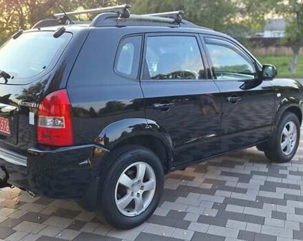 Черный Хендай Туксон, объемом двигателя 2 л и пробегом 190 тыс. км за 8150 $, фото 8 на Automoto.ua
