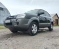 Черный Хендай Туксон, объемом двигателя 2 л и пробегом 160 тыс. км за 7600 $, фото 1 на Automoto.ua