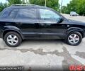 Черный Хендай Туксон, объемом двигателя 2 л и пробегом 235 тыс. км за 7900 $, фото 1 на Automoto.ua