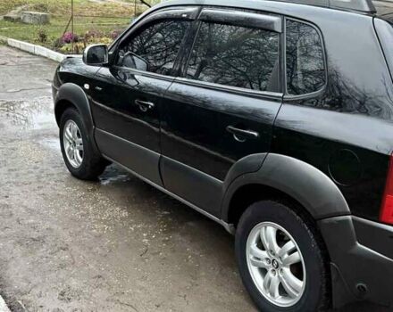 Черный Хендай Туксон, объемом двигателя 1.98 л и пробегом 273 тыс. км за 7400 $, фото 4 на Automoto.ua