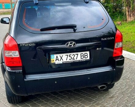 Черный Хендай Туксон, объемом двигателя 2 л и пробегом 175 тыс. км за 8900 $, фото 2 на Automoto.ua