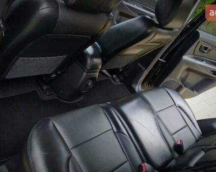Чорний Хендай Туксон, об'ємом двигуна 2 л та пробігом 229 тис. км за 8600 $, фото 134 на Automoto.ua