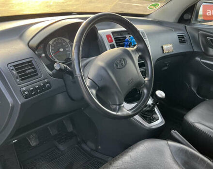 Черный Хендай Туксон, объемом двигателя 1.98 л и пробегом 243 тыс. км за 8500 $, фото 34 на Automoto.ua